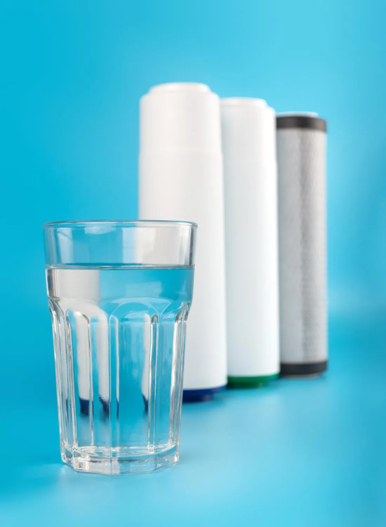set-three-cartridges-water-filter-with-clear-glass-water-blue-background-concept-water